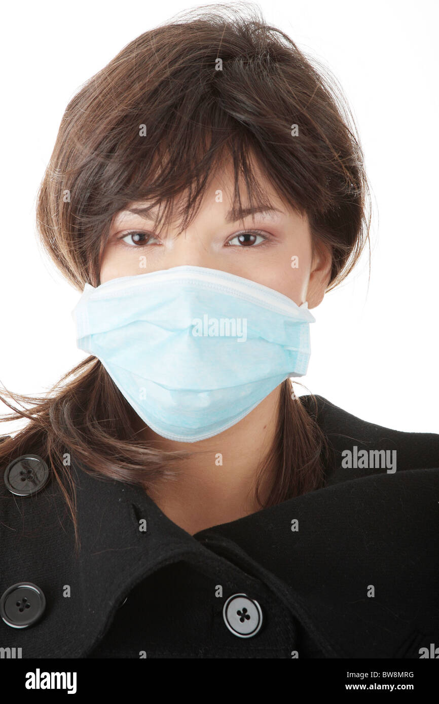 A glamorous model wearing a mask to prevent 'Swine Flu' infection. Isolated Stock Photo