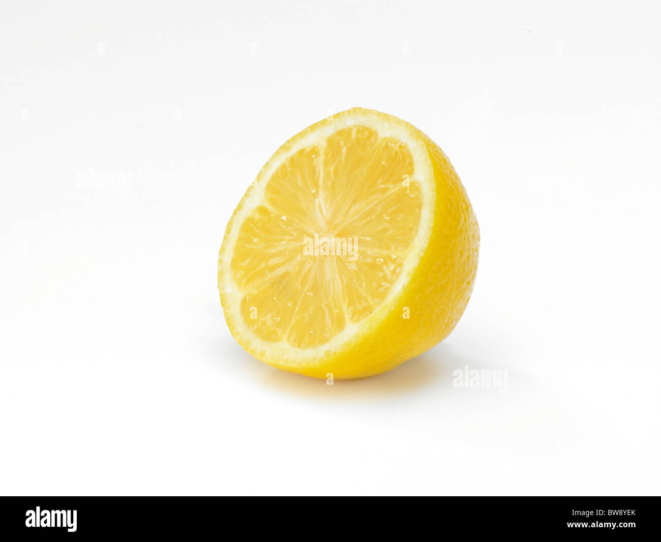 A Lemon sliced in half on a clean white background Stock Photo