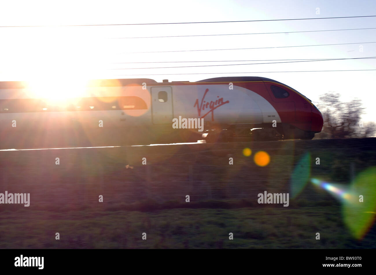Virgin Pendolino train and lens flare Stock Photo