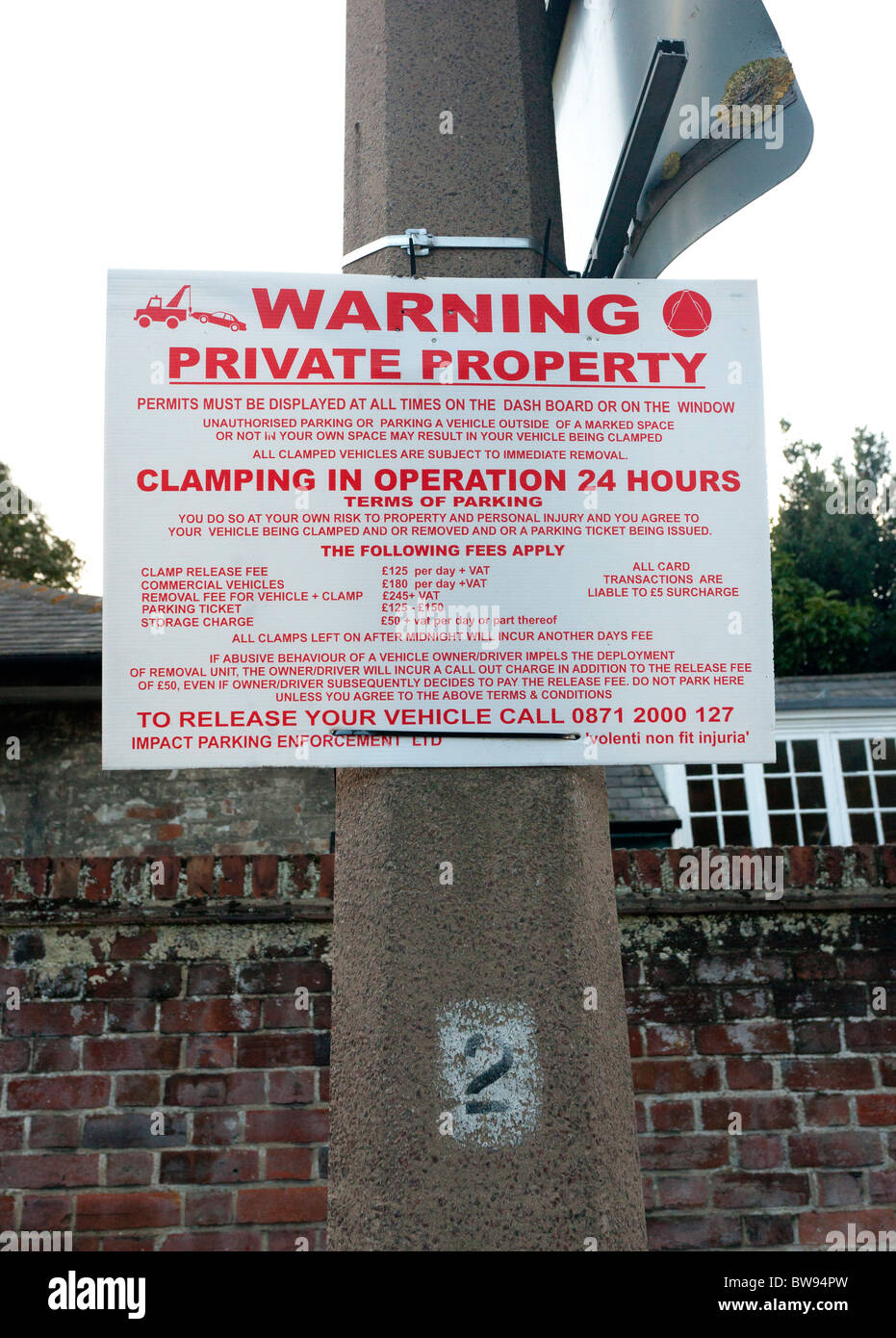 clamping warning sign in private car park in UK Stock Photo