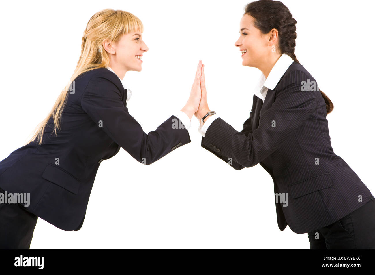 Portrait Of Two Pretty Women Looking At Each Other Over White 