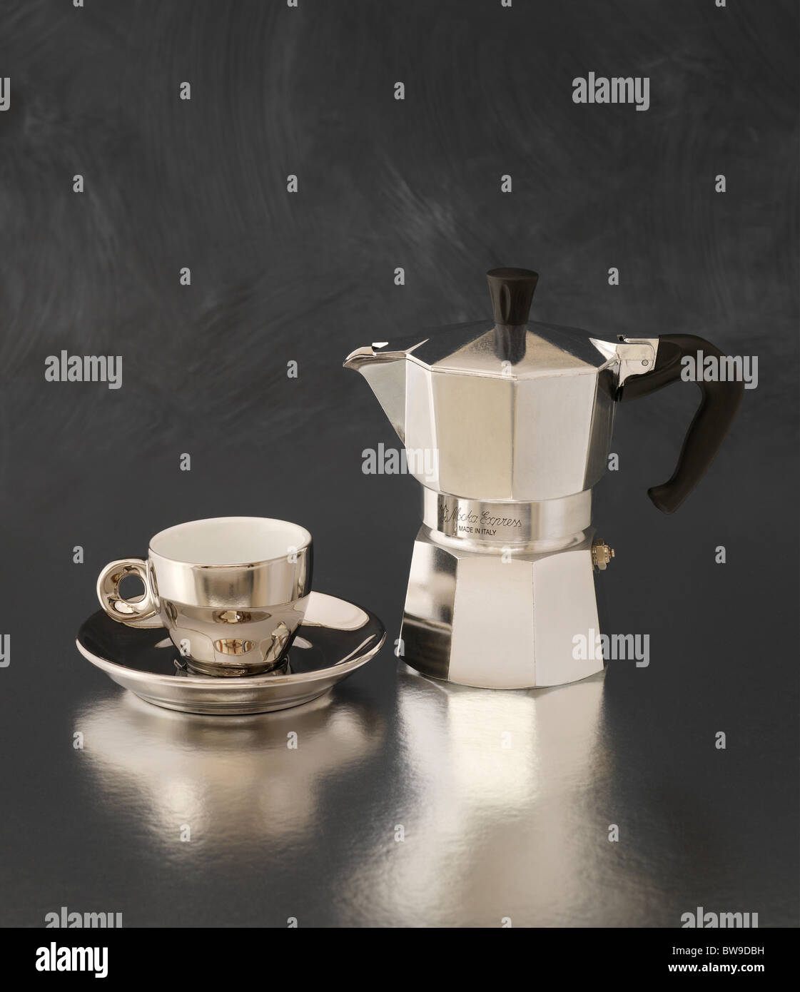 An Italian percolator and espresso cup and saucer Stock Photo Alamy