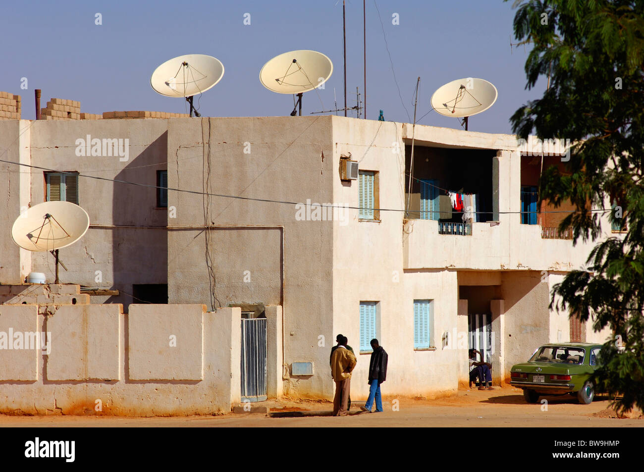 Modern residential buildings with satellite dishes on the roof in the town of Jerma, Libya Stock Photo