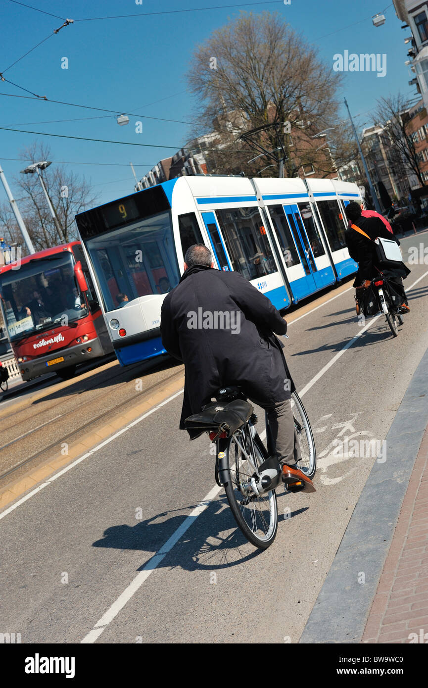Tram and bicycles in Amsterdam the Netherlands Stock Photo Alamy