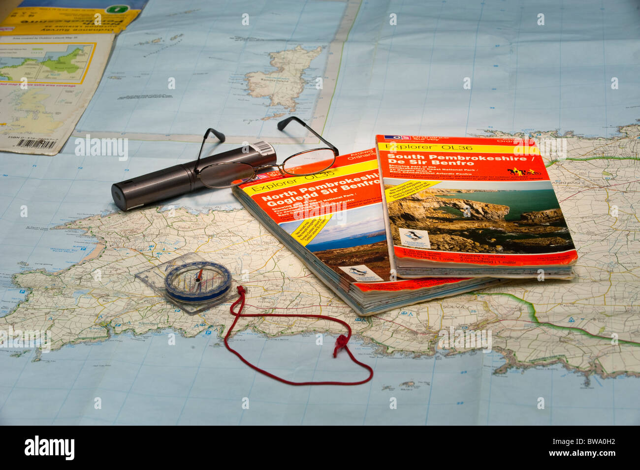 A Map and Compass being used for route planning Stock Photo Alamy