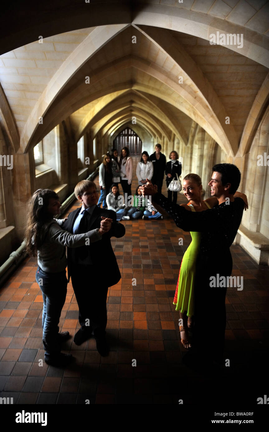 Slovakian ballroom dancers Metej Chren & Miroslava Kosorinova demonstrate good and bad examples of etiquette to a class of overs Stock Photo