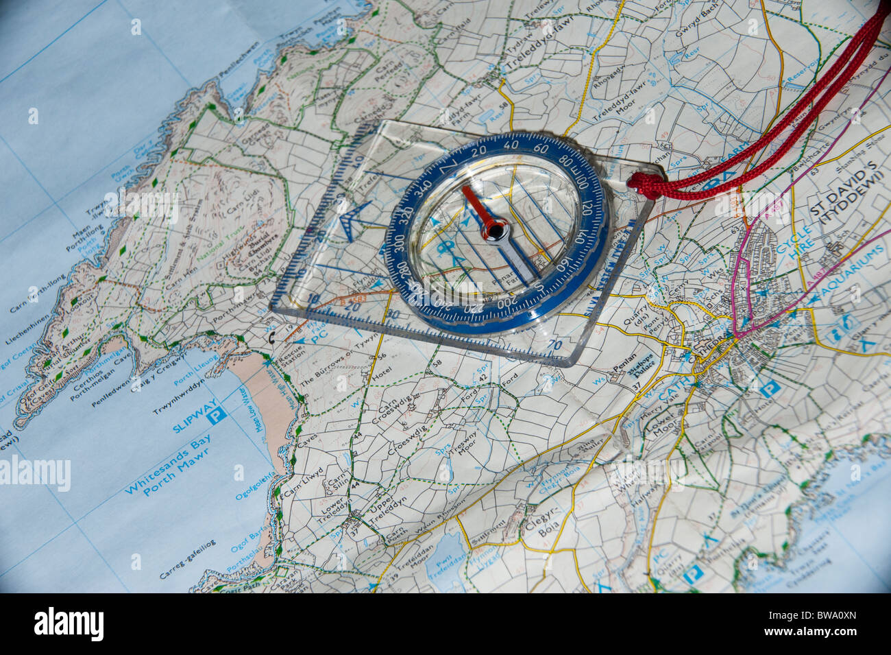 A Map and Compass being used for route planning Stock Photo Alamy