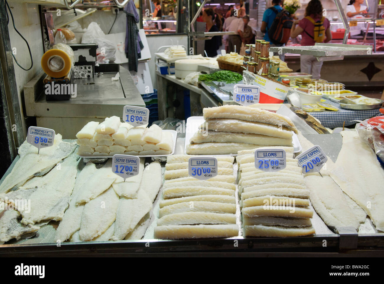 bacalao, dried salted cod fish on sale at stall in La Boqueria market hall in Barcelona, Spain Stock Photo