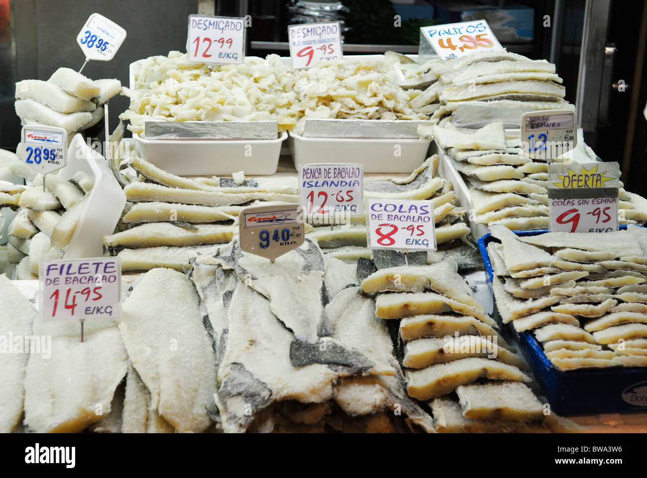 bacalao, dried salted cod fish on sale at stall in La Boqueria market hall in Barcelona, Spain Stock Photo