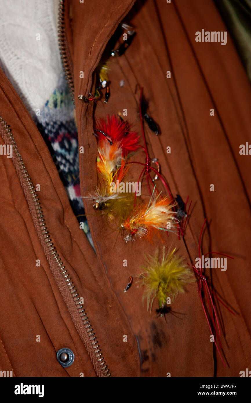 Close-up of a set of fly fishing bait pinned to a fishermans jacket, Sussex, UK. Stock Photo