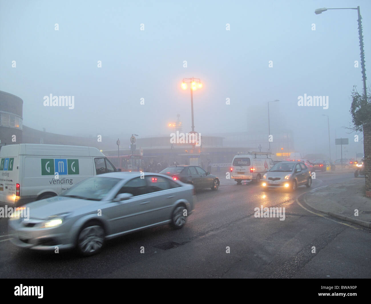London fog night dark foggy day street lights Stock Photo - Alamy