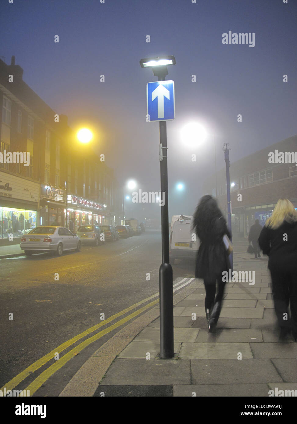 London fog night dark foggy day street lights Stock Photo - Alamy