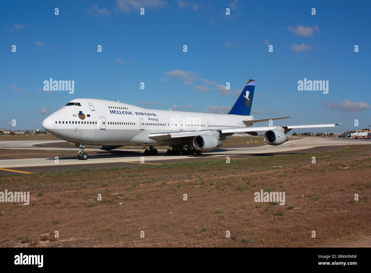 Commercial aviation. Hellenic Imperial Airways Boeing 747-200 taxiing on a taxiway at Malta International Airport shortly before departure Stock Photo