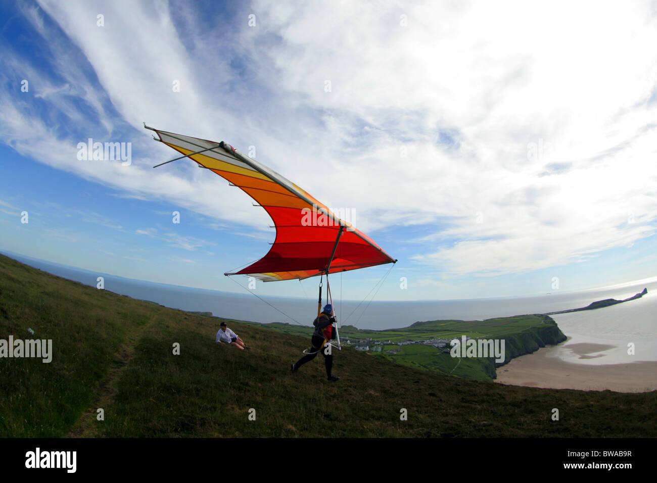 Old fashioned (1979) hang glider taking off at Rhossili on the Gower in