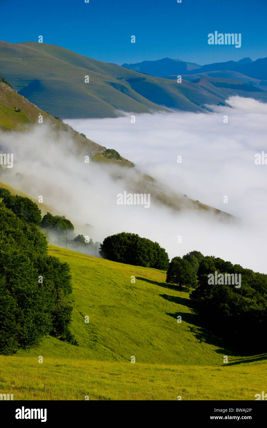 Foggy mist hangs in the Piano Grande, part of the Monti Sibillini National Park, Umbria Italy Stock Photo