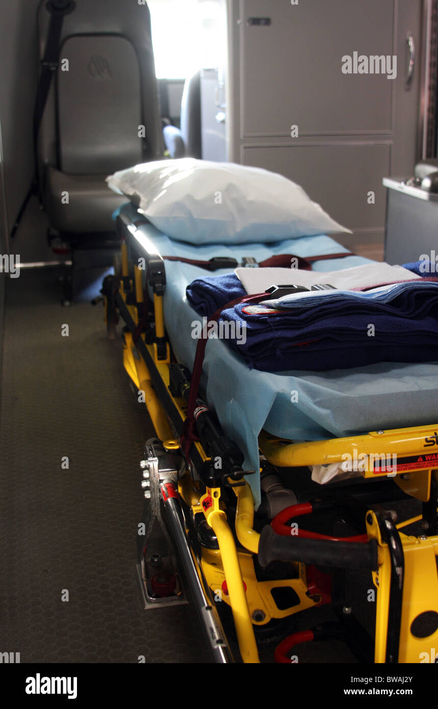 The inside of an ambulance with a cot for passengers and patients EMS