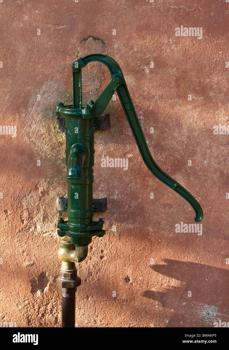 Traditional hand-pump as used to pump water from a well for domestic use Stock Photo