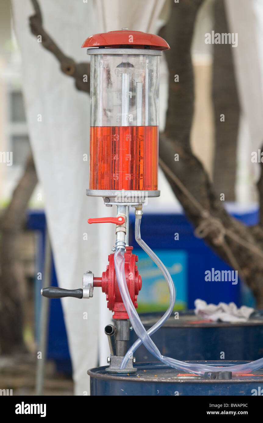 Classic hand powered gasoline pump mounted on a barrel Stock Photo Alamy