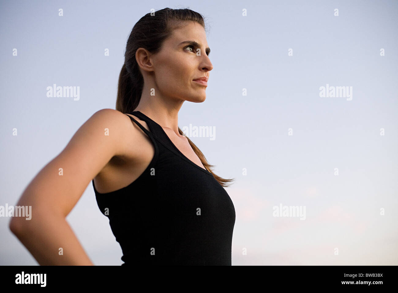 Young woman looking away Stock Photo - Alamy