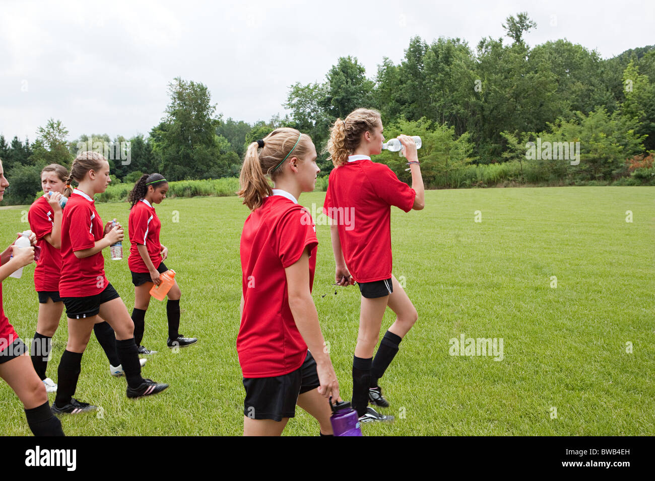 Girl soccer players on field Stock Photo