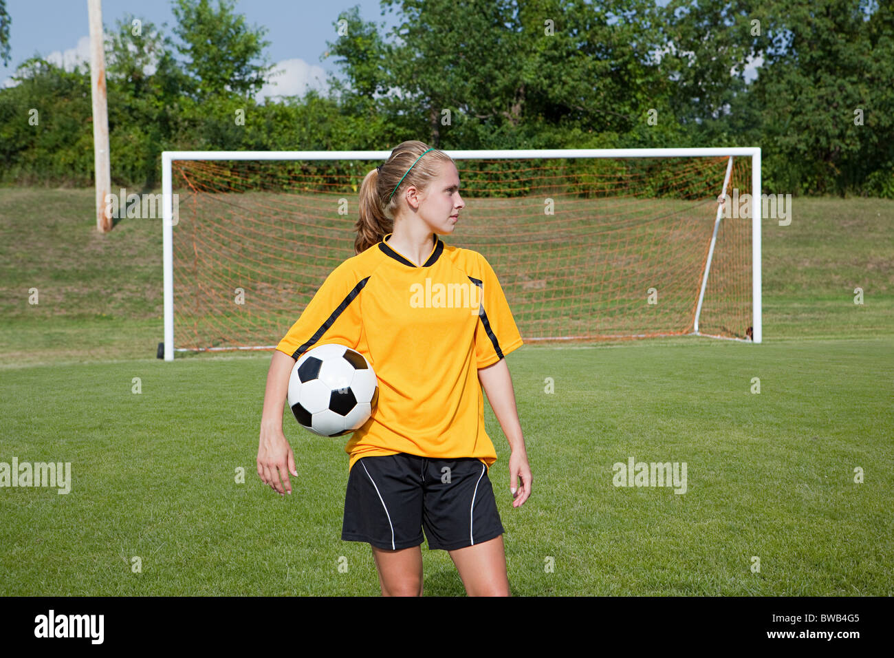 Girl soccer player with ball Stock Photo Alamy