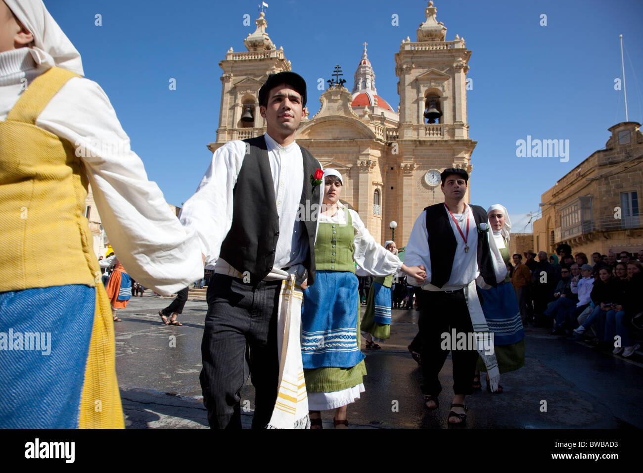 Participant couples performing a medieval dance of gaiety and love and rebellion during Carnival in Gozo in Malta. Stock Photo