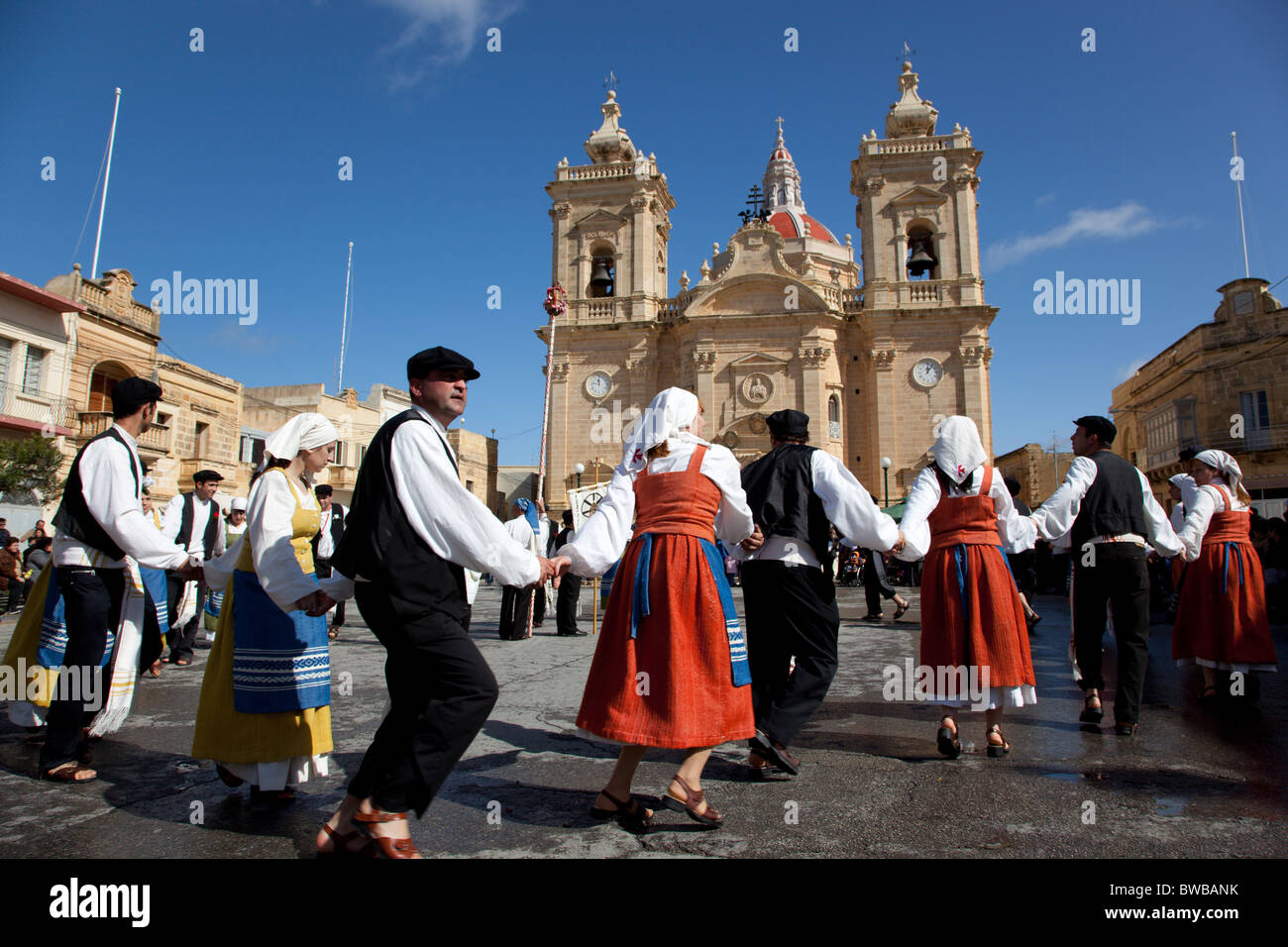 Participant couples performing a medieval dance of gaiety and love and rebellion during Carnival in Gozo in Malta. Stock Photo