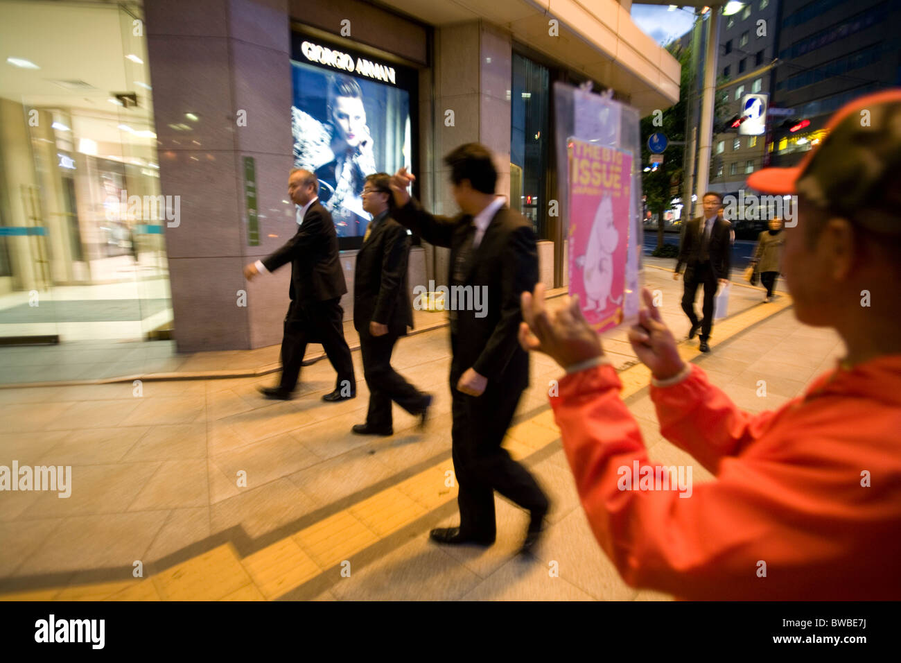 A man selling the Big Issue magazine in Hiroshima, Japan. Stock Photo