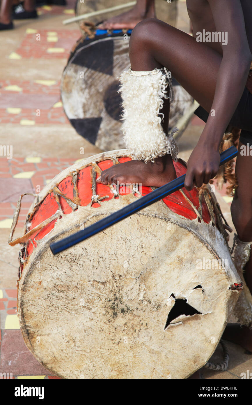 Boy playing drum in traditional Zulu dance at uShaka Marine World, Durban, KwaZulu-Natal, South Africa Stock Photo