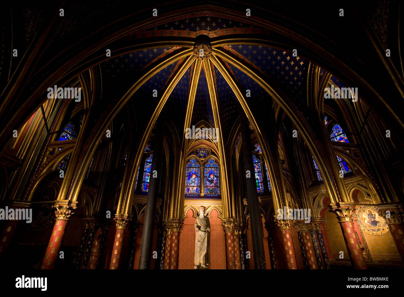 Vaulted ceiling painted and stained glass windows in Sainte-Chapelle Stock Photo
