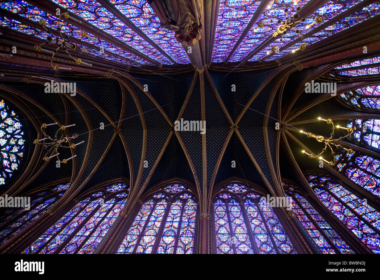 ceiling painted and stainedglass windows depicting biblical scenes in