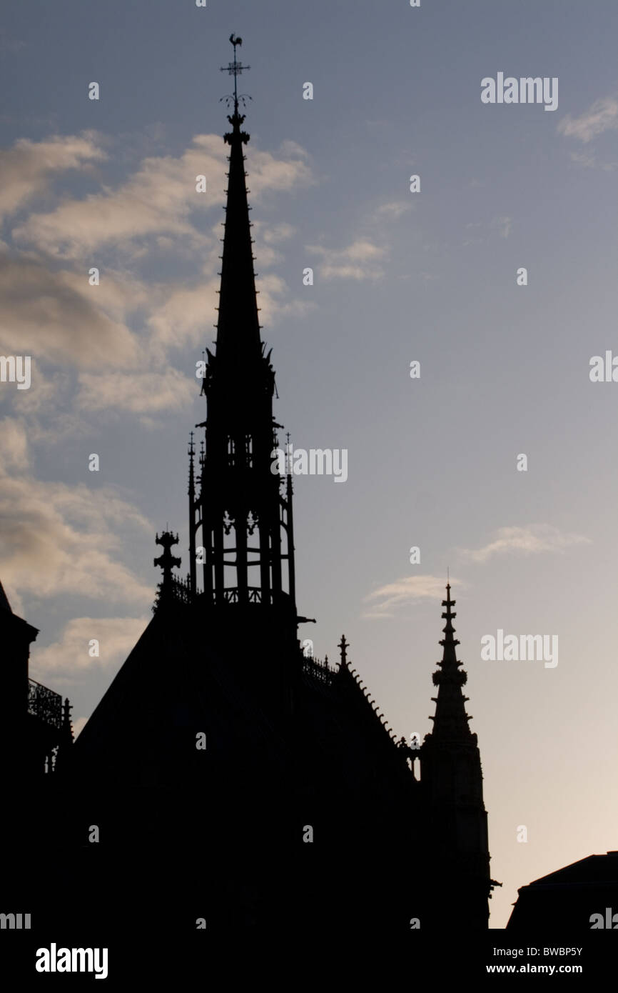 The spire of Sainte-Chapelle silhoutted against the sky Stock Photo