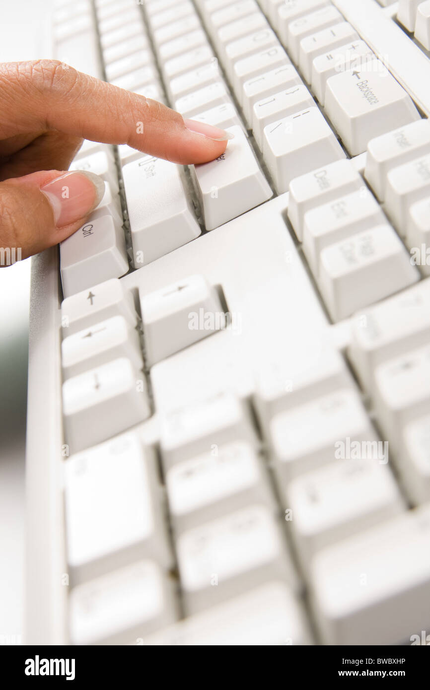 Close-up of female forefinger pressing enter button of keypad Stock ...