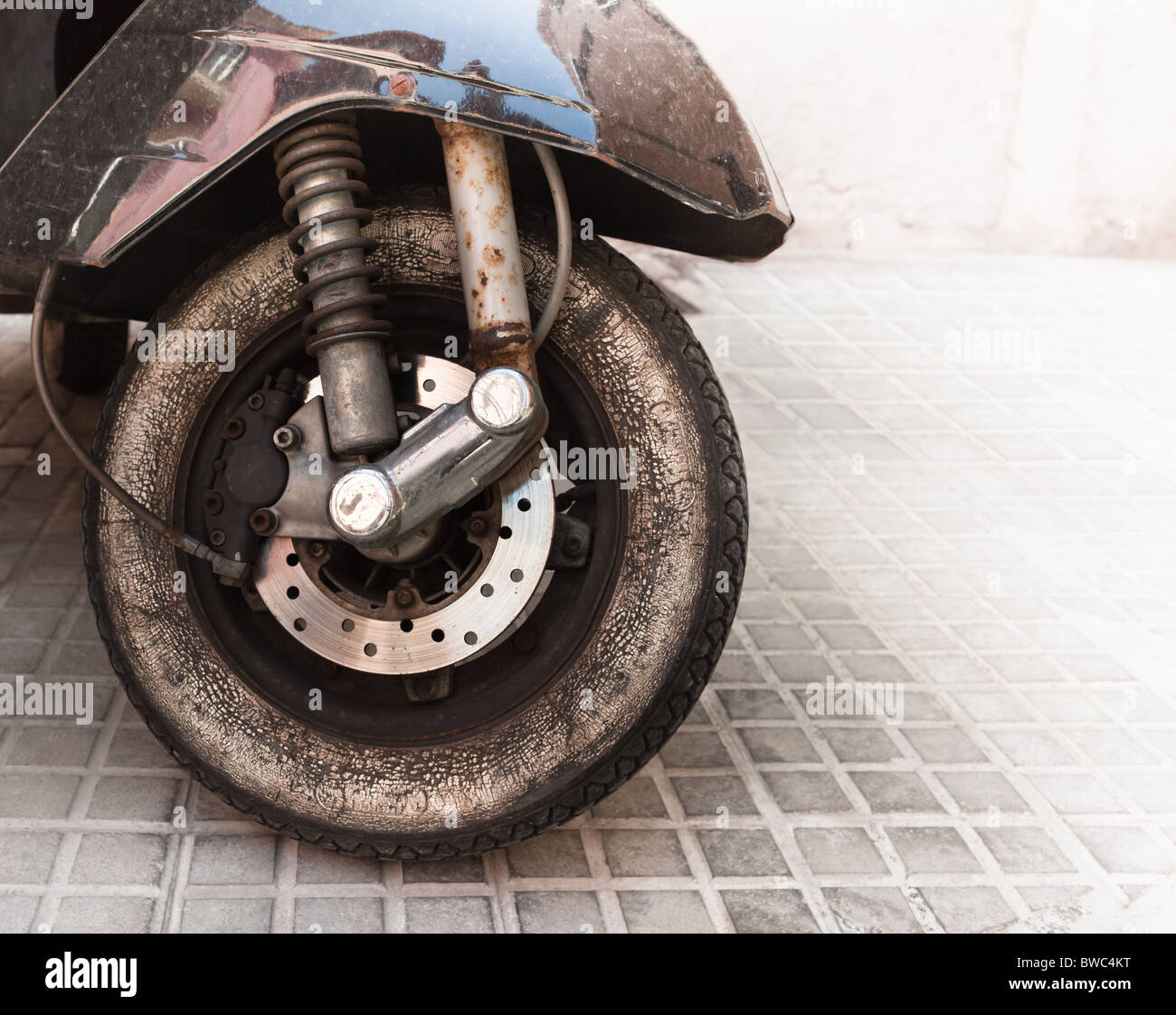 Old moped wheel Stock Photo