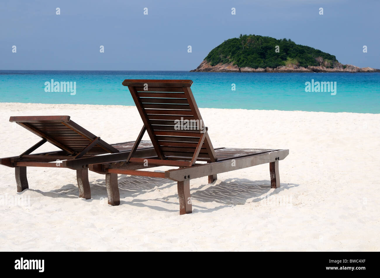 Quiet beach atmosphere with two chairs Stock Photo