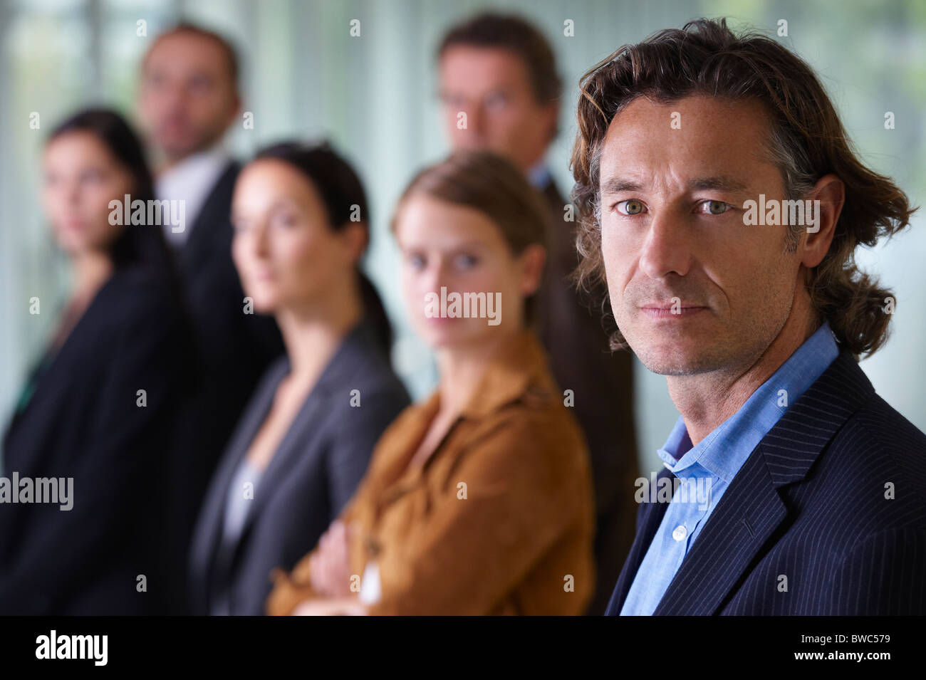 Business team smiling Stock Photo - Alamy