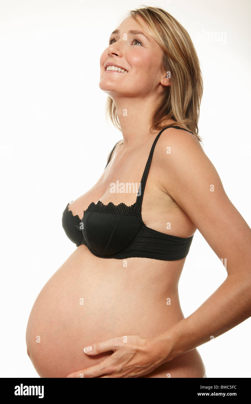 Pregnant woman, smiling Stock Photo