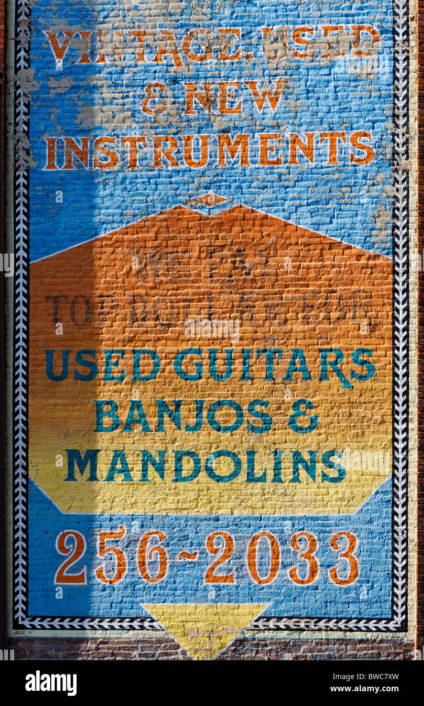 Sign painted on the wall of a musical instrument store, Broadway, The District, Nashville, Tennessee, USA Stock Photo