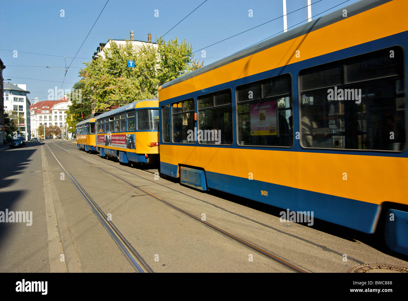 Queue of older electric trolley tram cars public transit transportation