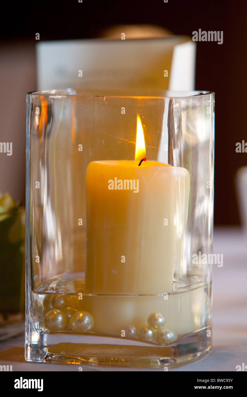 yellow white burning candle standing in a glass vase large yellow white burning candle standing in a glass vase or chandelier BWC95Y