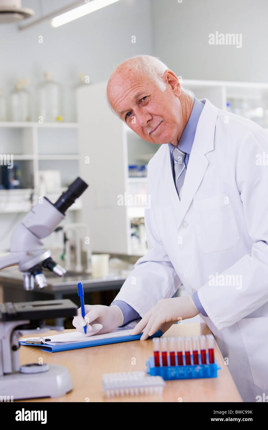 Male scientist doing research in laboratory, portrait Stock Photo - Alamy