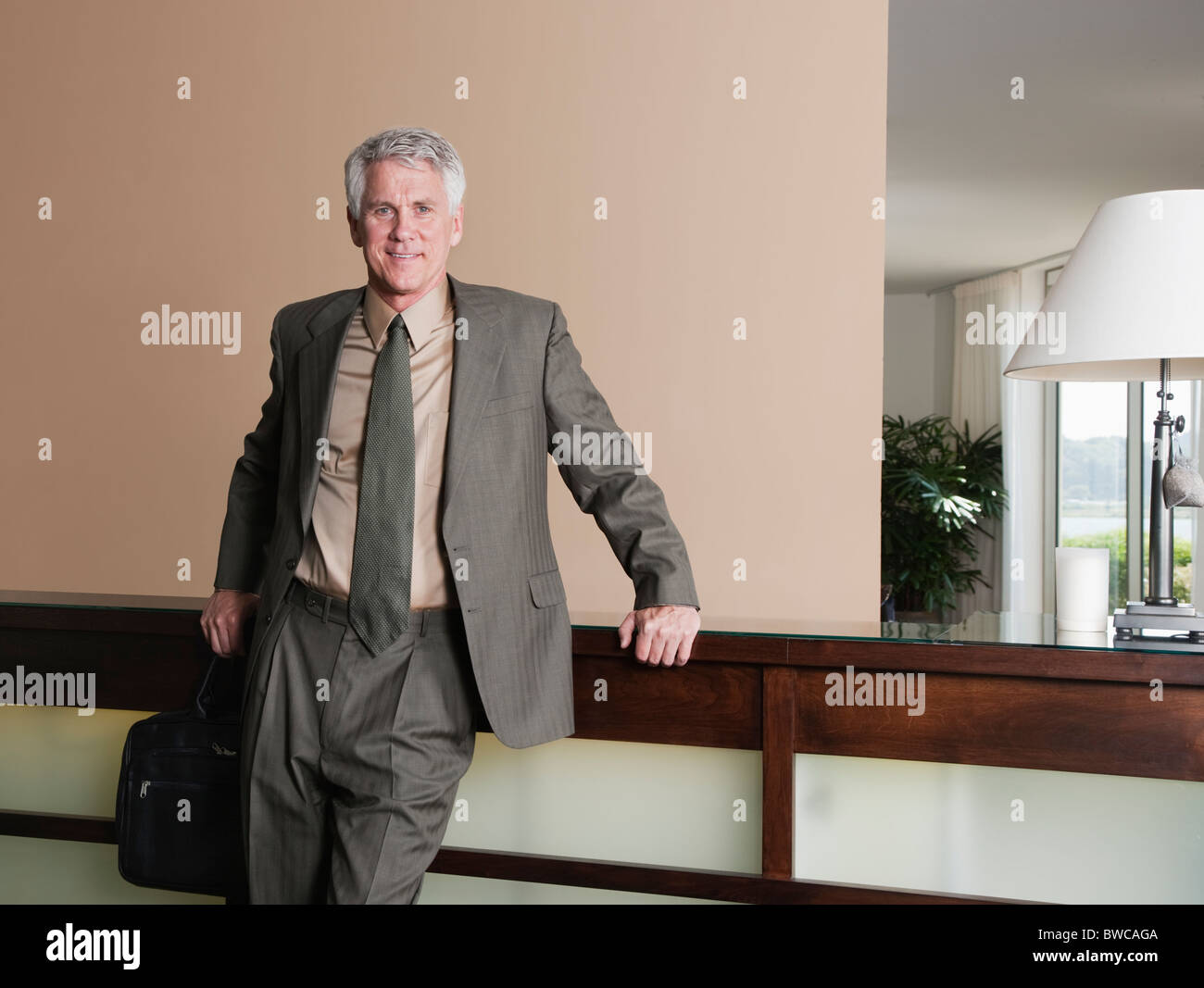 USA, California, Mill Valley, Businessman at hotel reception Stock Photo