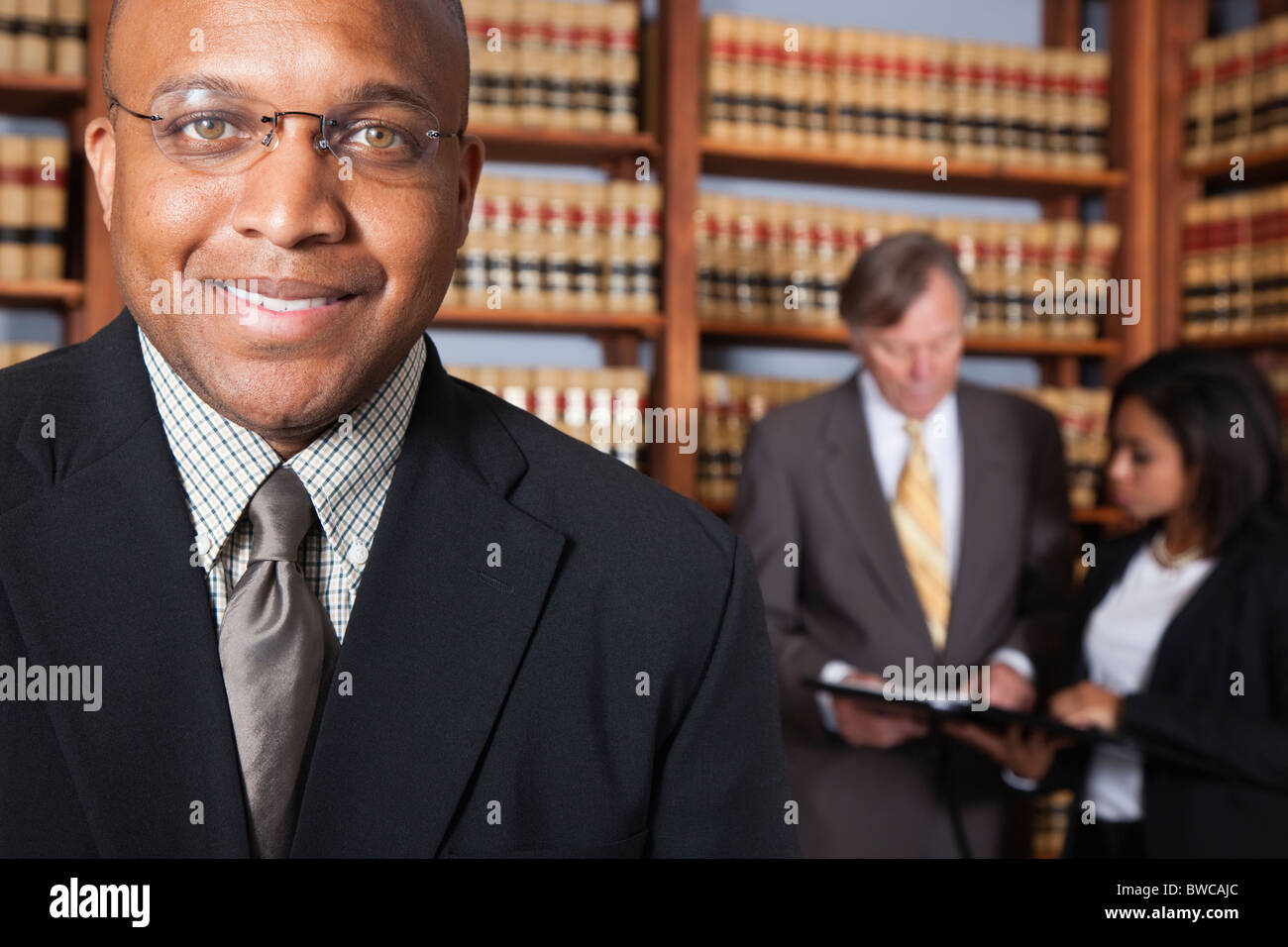 USA, California, Oakland, Business people in library, focus on man