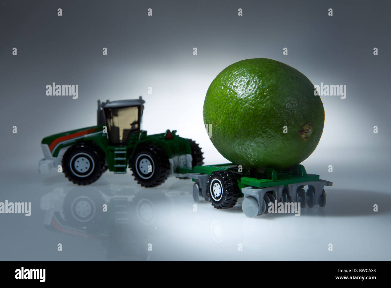 A toy truck with fruit on the back to show transport of farm in a abstract creative way Stock Photo