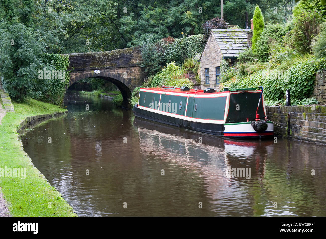 Narrowboat on the Huddersfield Narrow Canal at Uppermill, Lancashire, England, UK Stock Photo