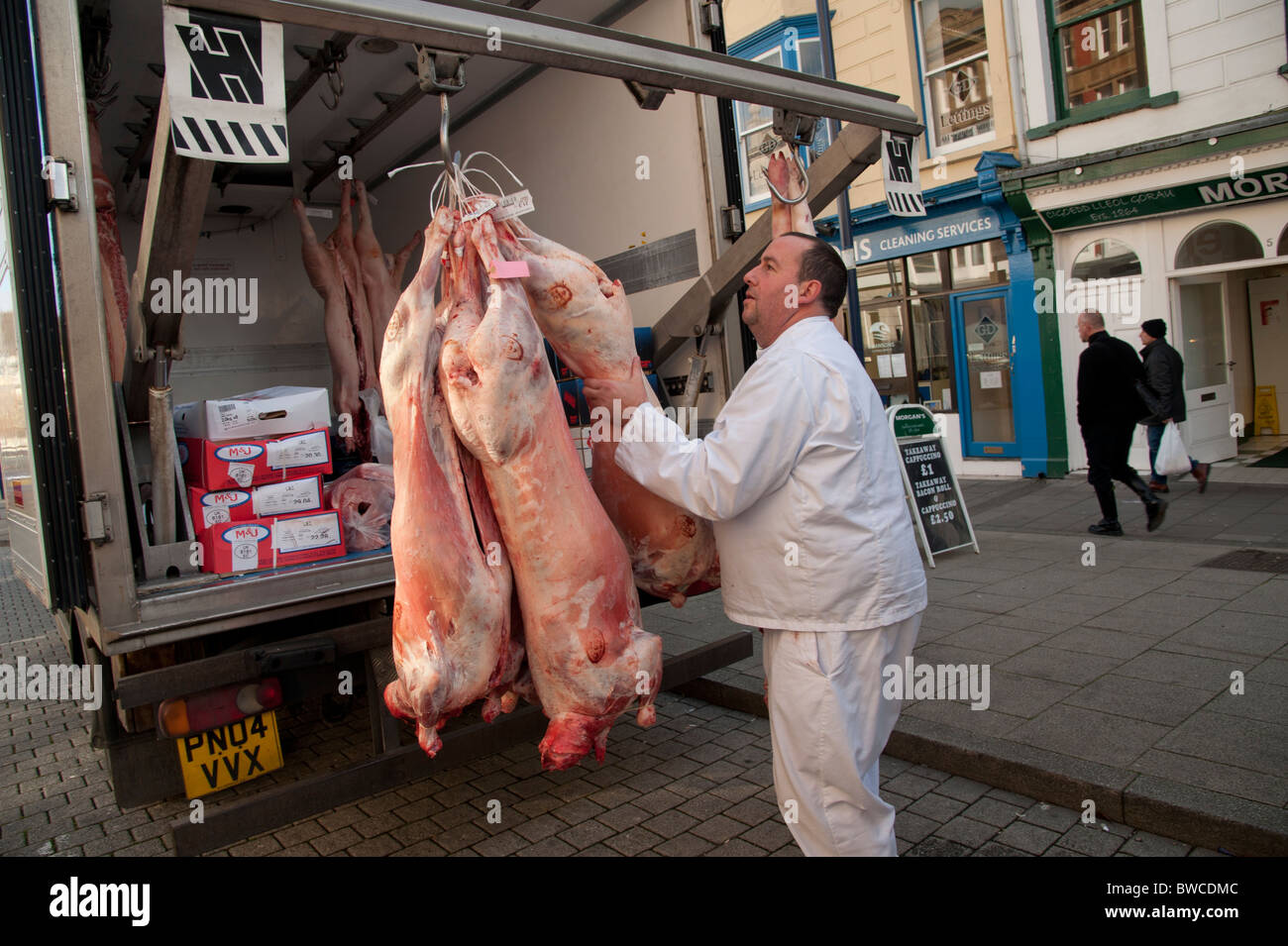 Fresh meat being delivered to a small family butcher, Aberystwyth Wales UK Stock Photo