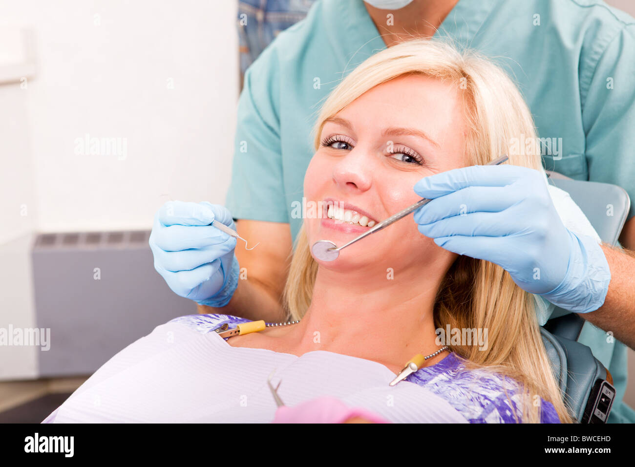 A smiling woman at the dentist ready for a check-up Stock Photo