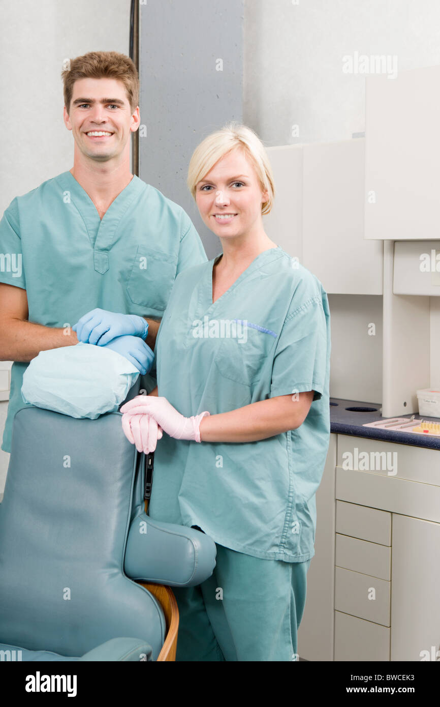 A happy dentist and assistant standing in a dental clinic Stock Photo