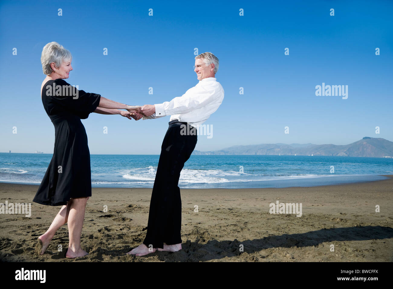 Woman dancing barefoot on sand hi-res stock photography and images - Alamy