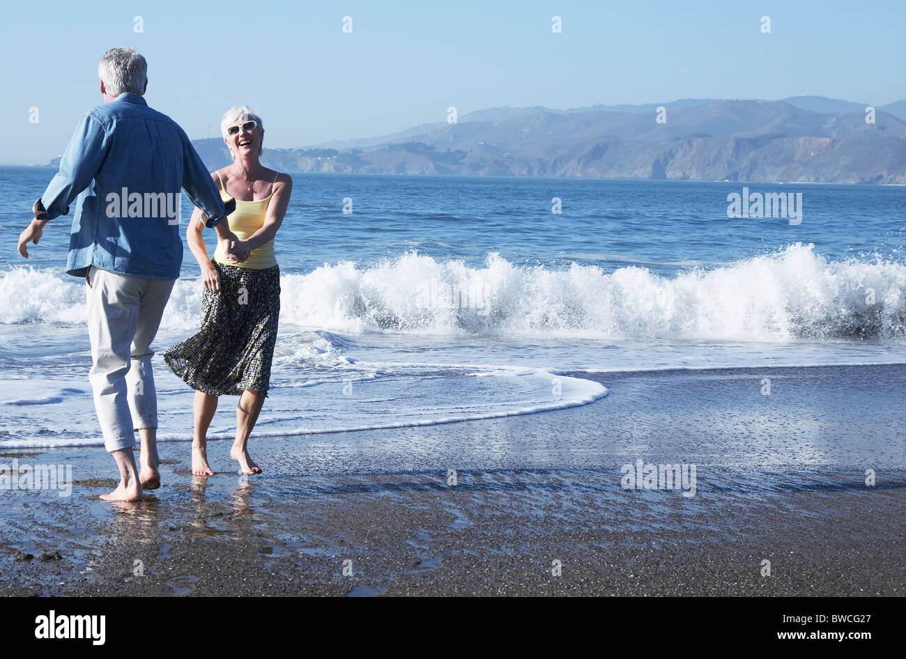 Woman dancing barefoot on sand hi-res stock photography and images - Alamy